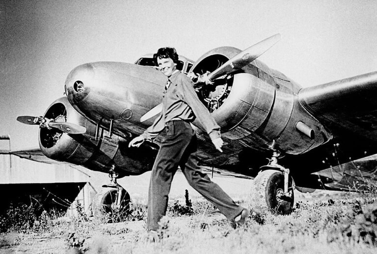 Amelia Earhart walking in front of her Lockheed Electra 10-E [Credit: FLYING Archive]
