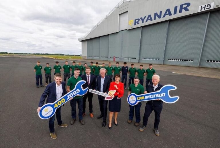 Ryanair Warns Shannon Hangar Delays Could Shift Investment, Jobs To Poland ryanair executives and staff pose outside an aircraft hangar